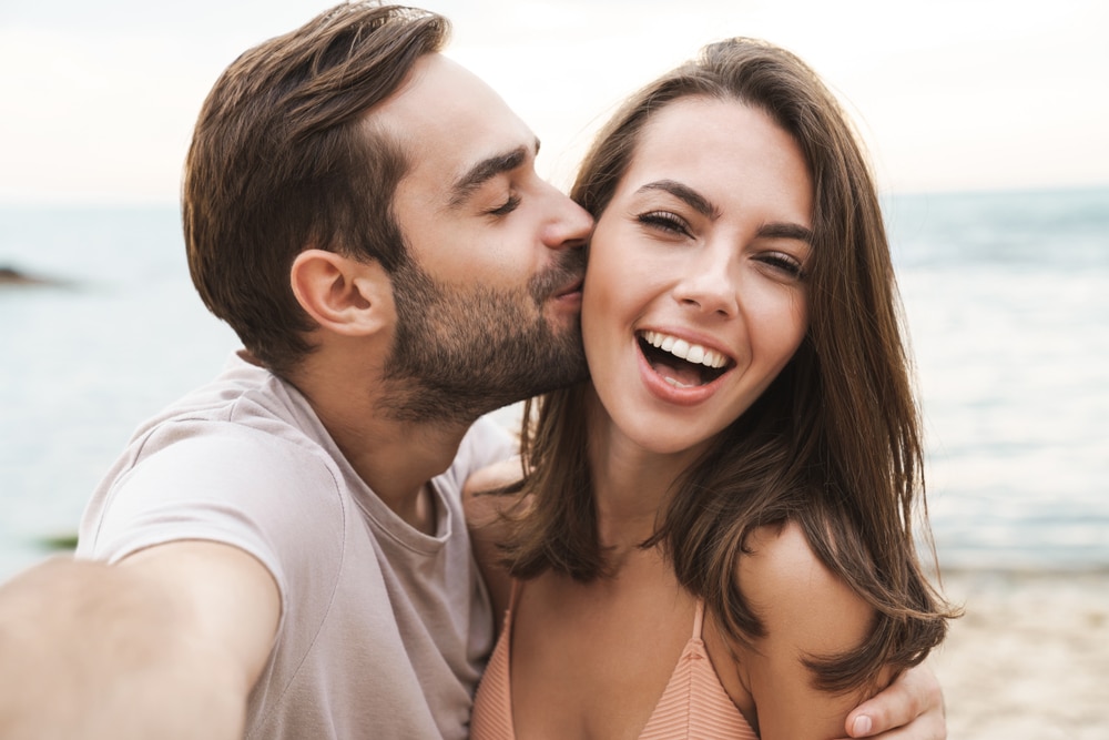 woman showing off healthy smile after getting dental crowns in Ocala, FL