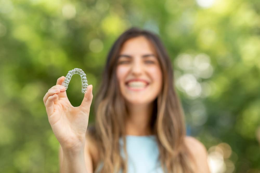 Ocala woman holding invisalign tray