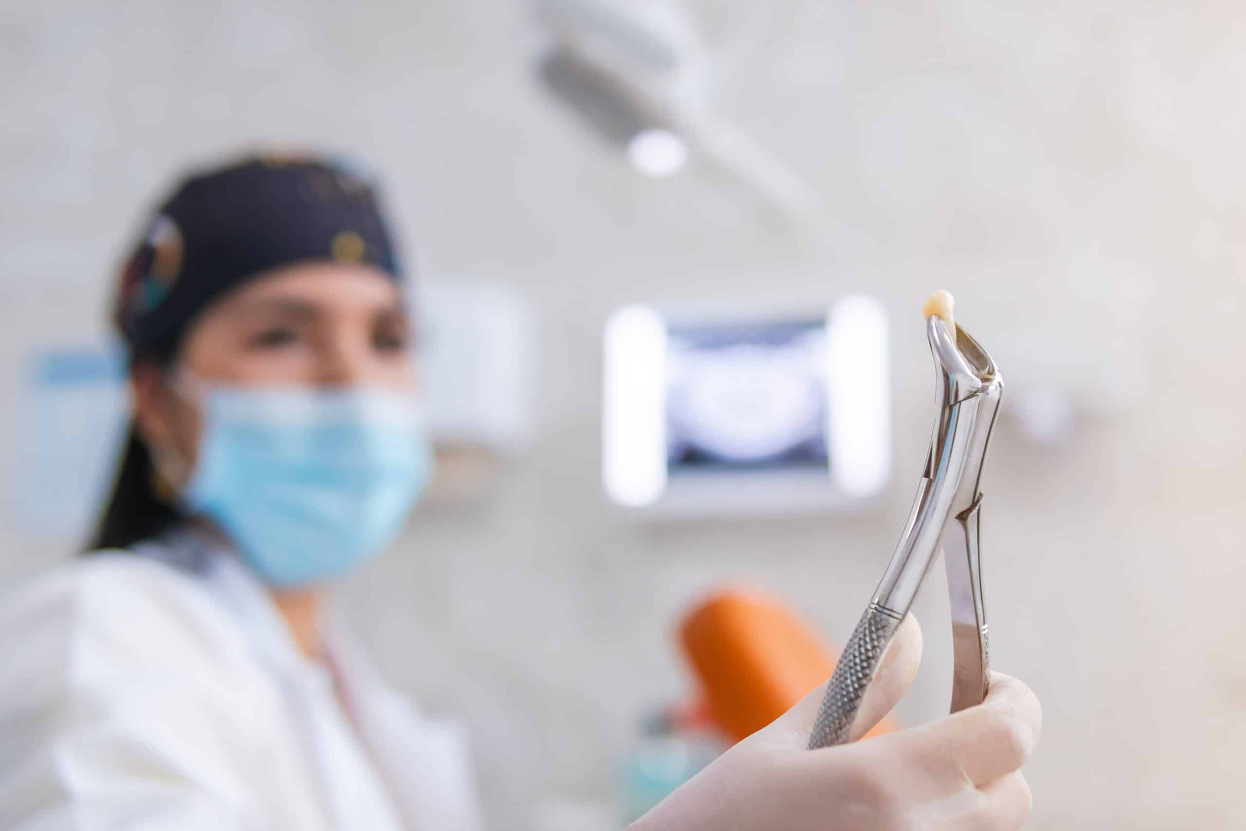 doctor pulling a tooth in Ocala