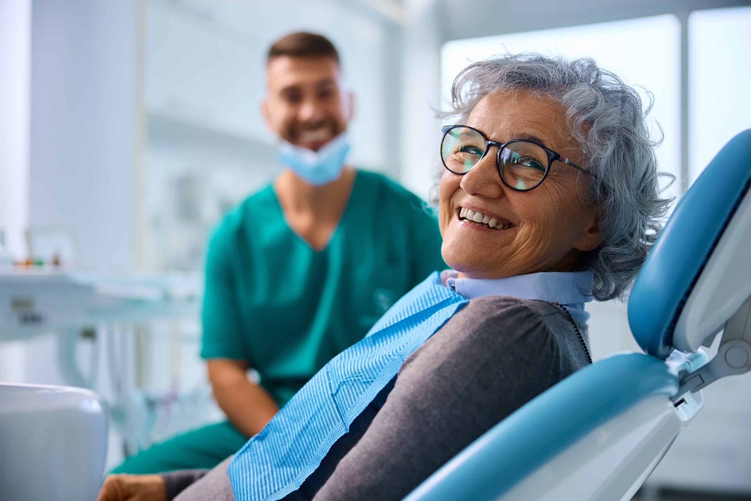 happy senior woman satisfied with her dental restoration